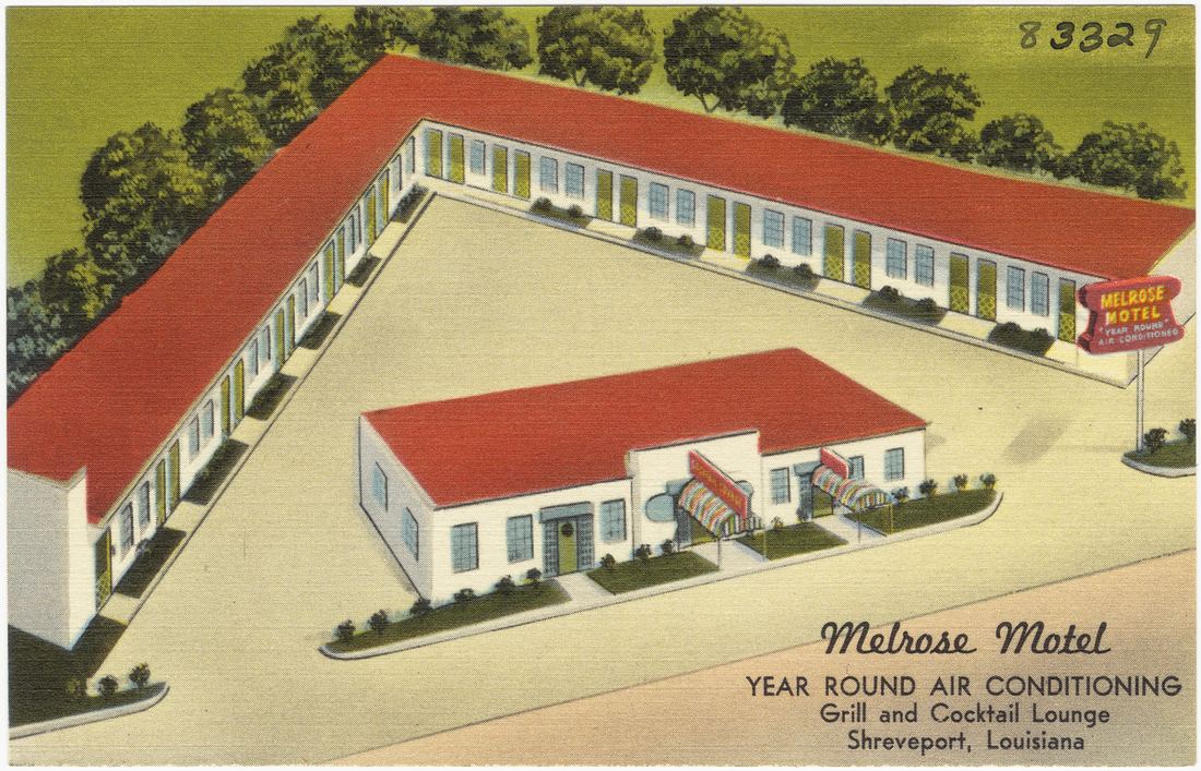 A vintage postcard of a motel advertising year round air conditioning