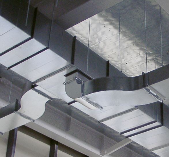Rectangular sheet metal ducts with a connection hanging from a ceiling