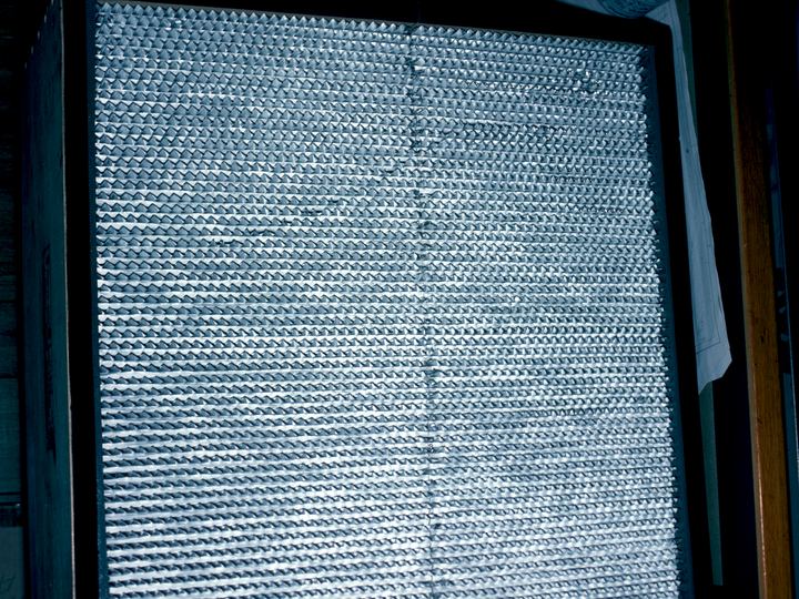 Close-up of tightly pleated white filter media