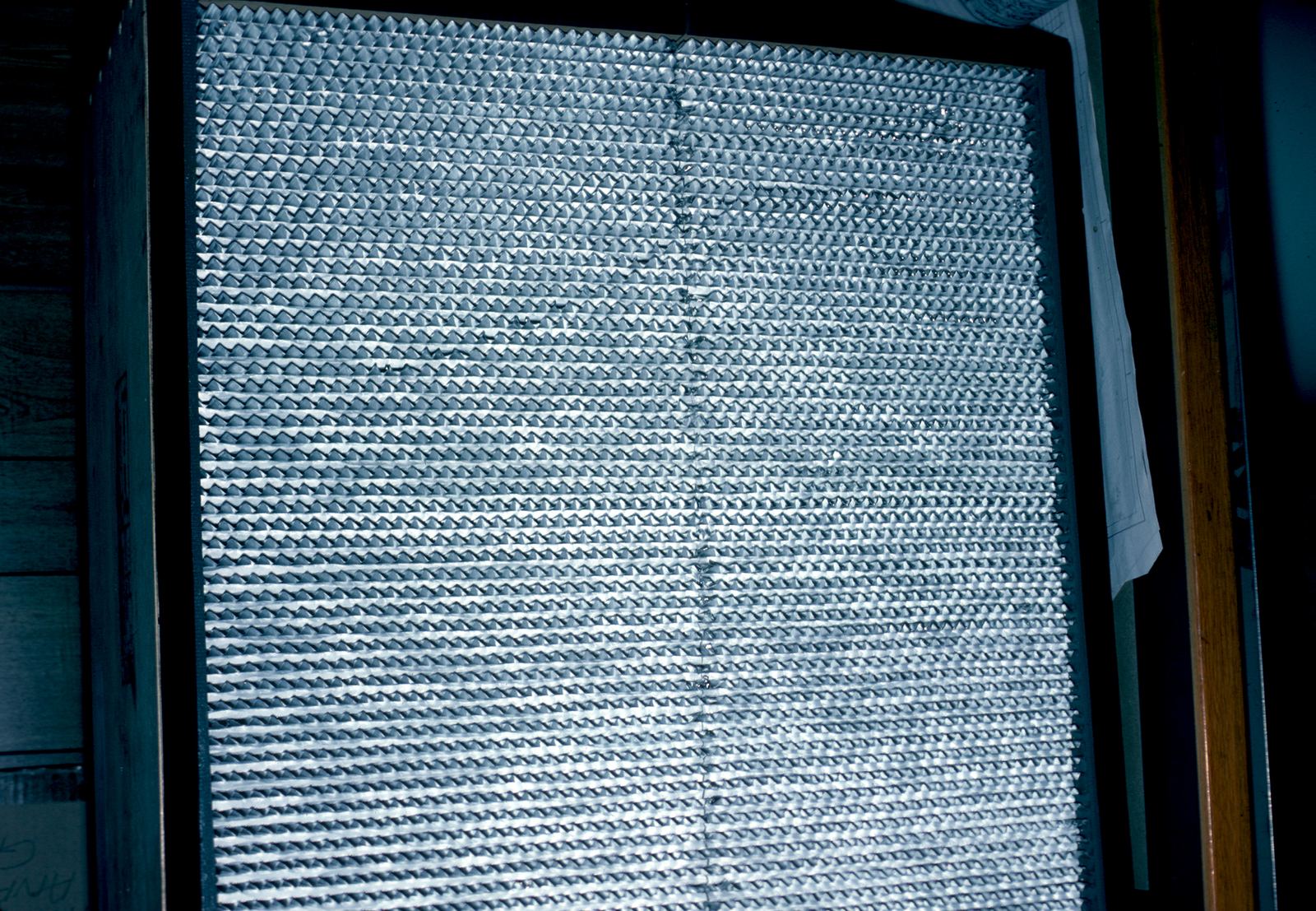 Close-up of tightly pleated white filter media
