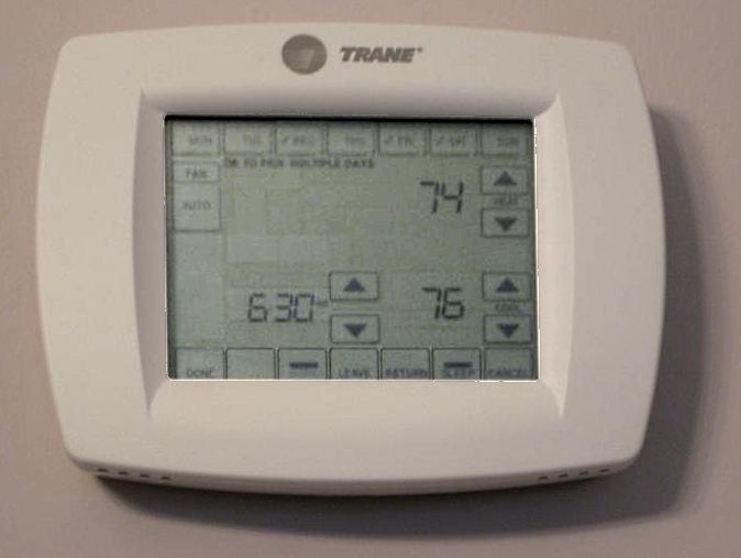 A touch-screen programmable thermostat showing a schedule and temperatures